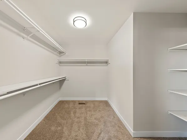 a view of an empty walk in closet