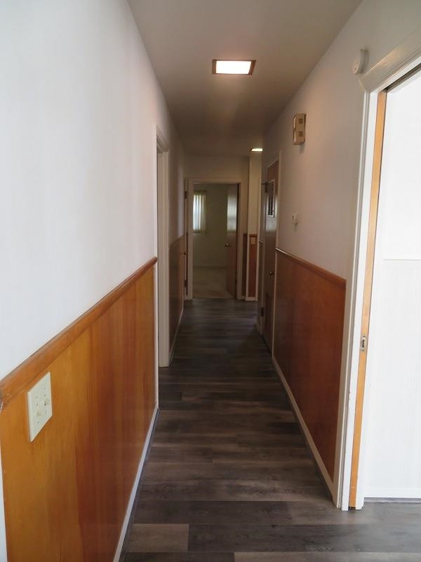3405 37th Street Lubbock, TX 79413 - Photo 11 of 24 a view of a hallway with wooden floor