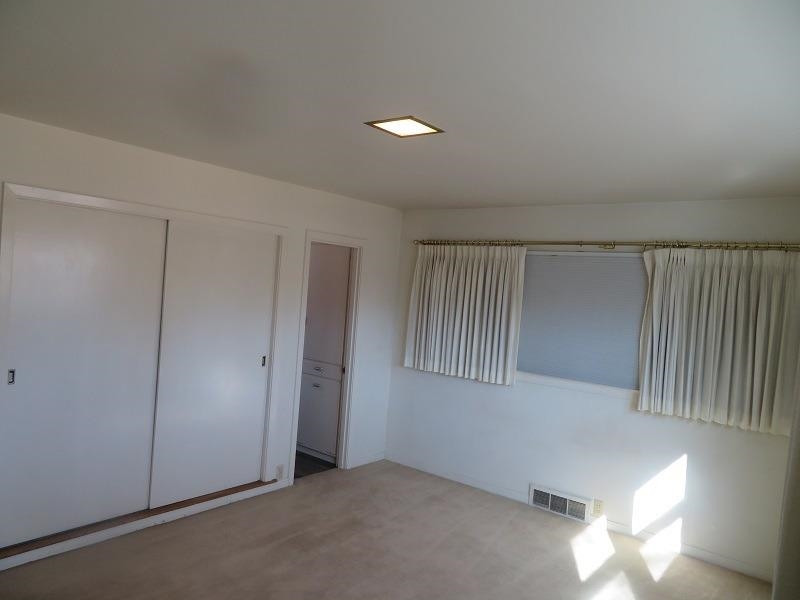 3405 37th Street Lubbock, TX 79413 - Photo 13 of 24 an empty room with windows