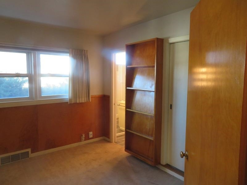 3405 37th Street Lubbock, TX 79413 - Photo 17 of 24 an empty room with windows and closet