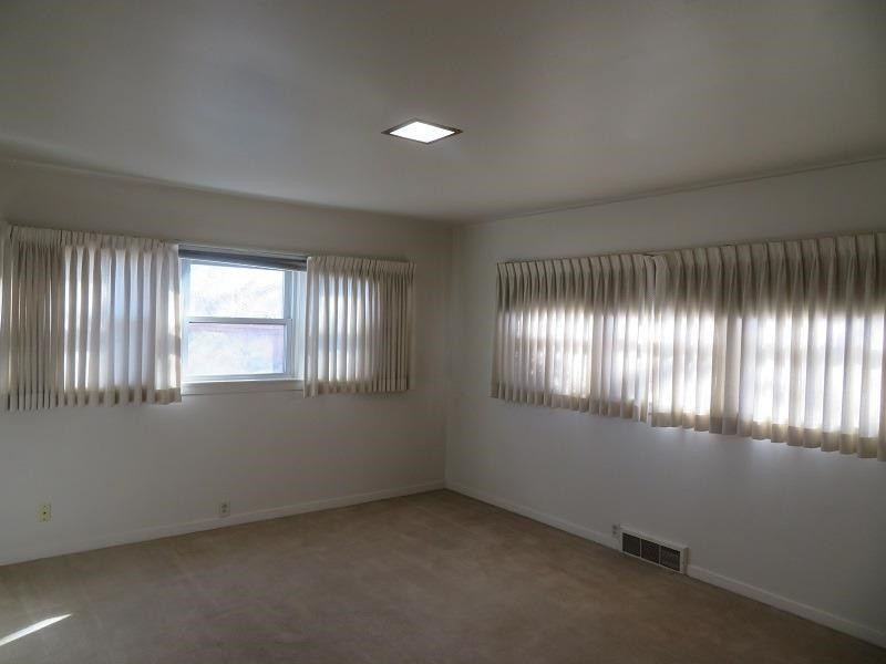 3405 37th Street Lubbock, TX 79413 - Photo 19 of 24 an empty room with windows