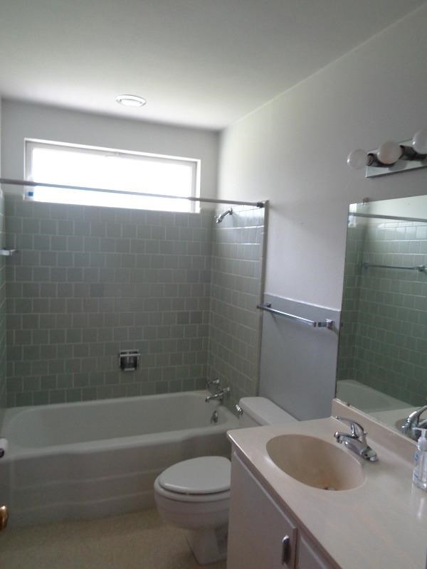 3405 37th Street Lubbock, TX 79413 - Photo 20 of 24 a bathroom with a sink a toilet and shower