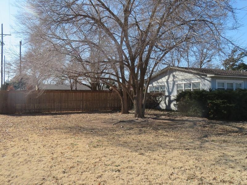 3405 37th Street Lubbock, TX 79413 - Photo 2 of 24 a backyard of a house with lots of green space