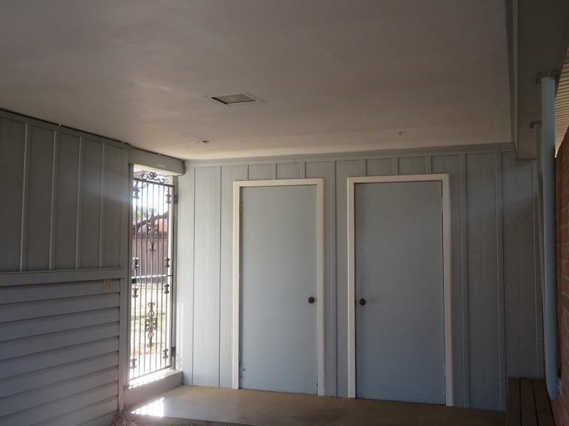 3405 37th Street Lubbock, TX 79413 - Photo 21 of 24 a view of an empty room with wooden floor and a window