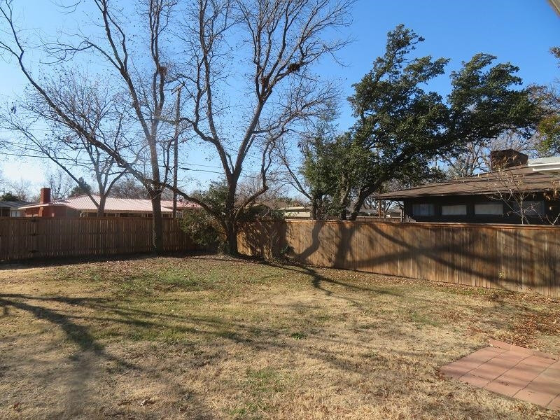 3405 37th Street Lubbock, TX 79413 - Photo 23 of 24 a view of a house with a yard