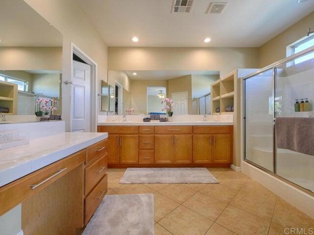 80596 Key Largo Avenue Indio, CA 92201 - Photo 14 of 59 a large kitchen with a sink and stainless steel appliances