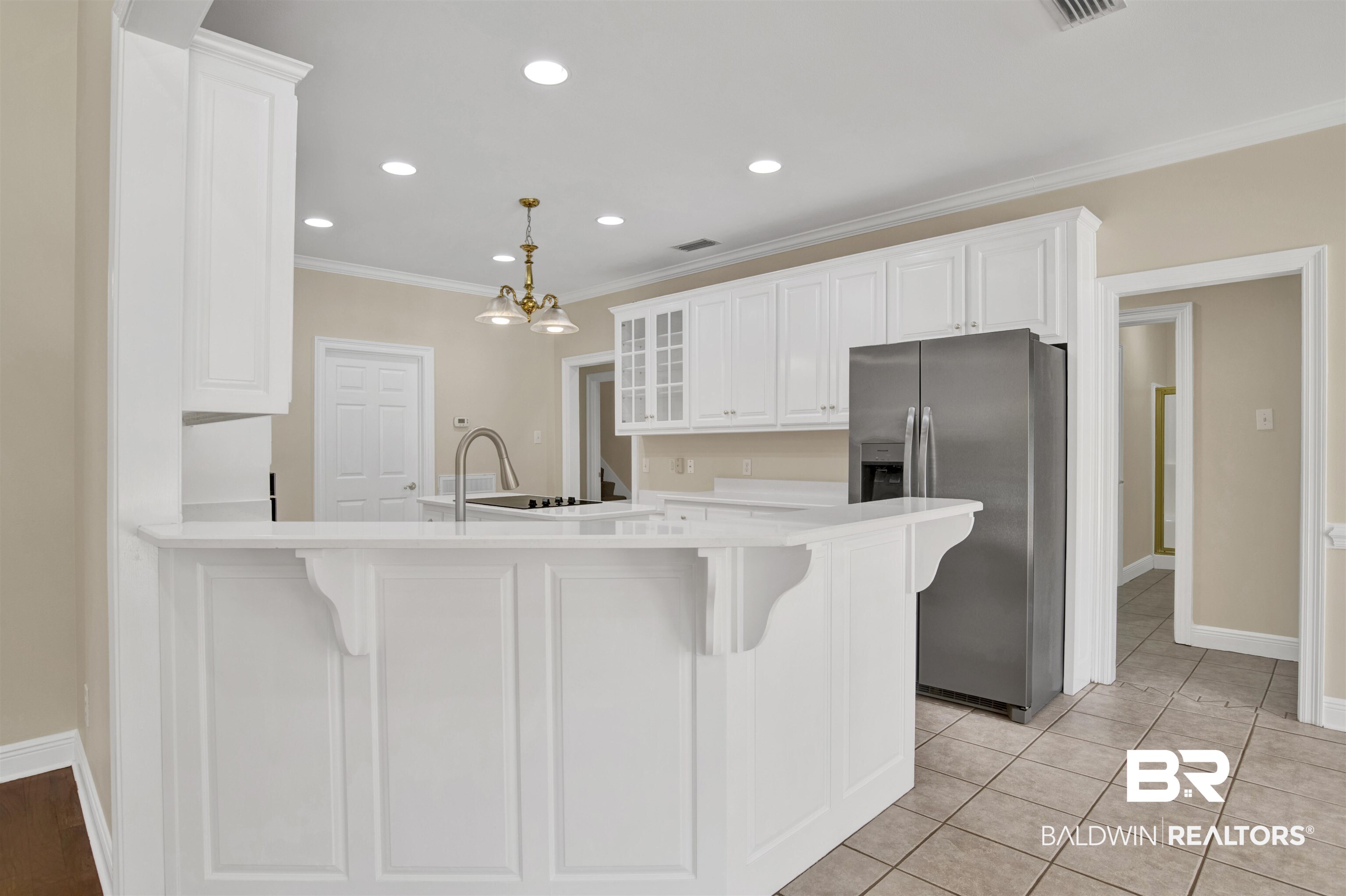 8847 Dawes Lake Road South Mobile, AL 36619 - Photo 7 of 47 Kitchen featuring white cabinetry, a stainless steel refrigerator, white countertops, and a tiled floor