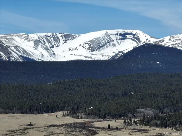 a view of a backyard of the house