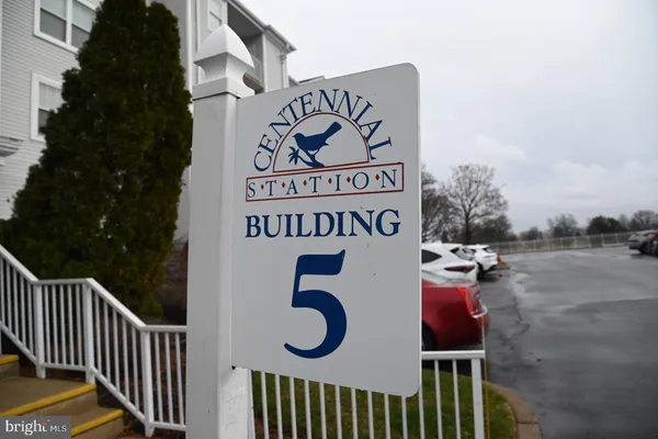 a view of a sign board and yard