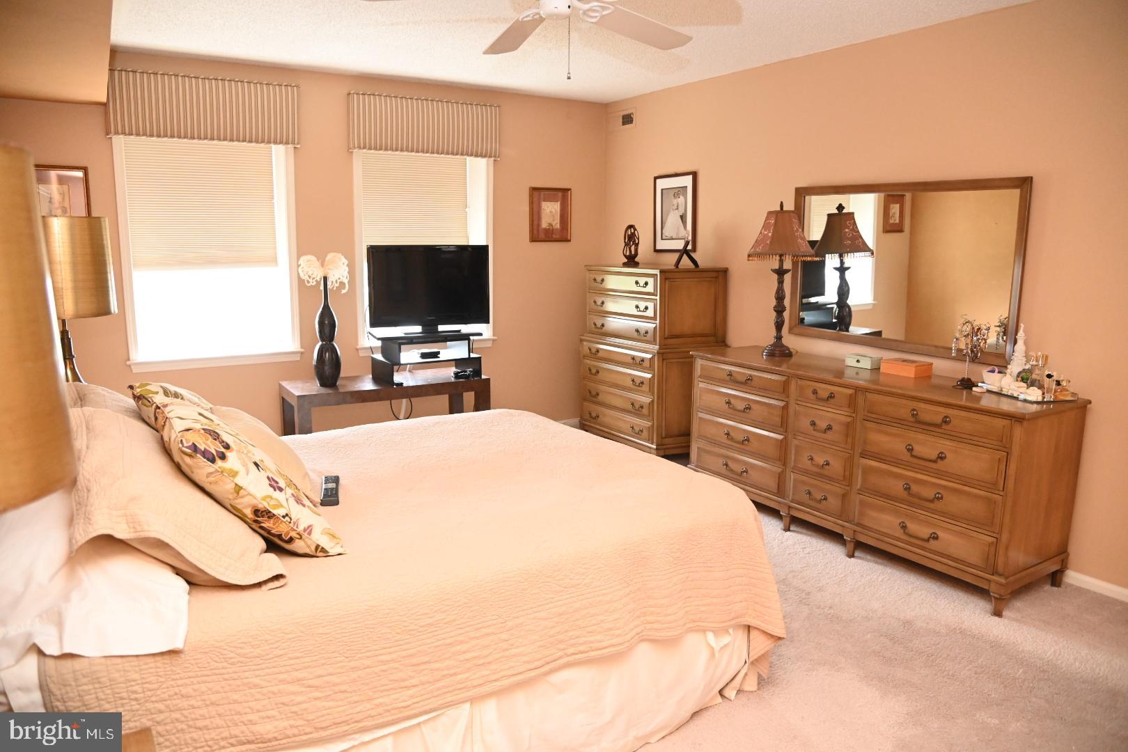 5303 Centennial Station Warminster, PA 18974 - Photo 15 of 60 a bedroom with a bed and a flat screen tv