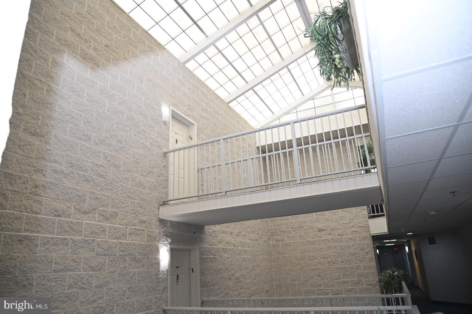 5303 Centennial Station Warminster, PA 18974 - Photo 33 of 60 a view of staircase with white walls and a window