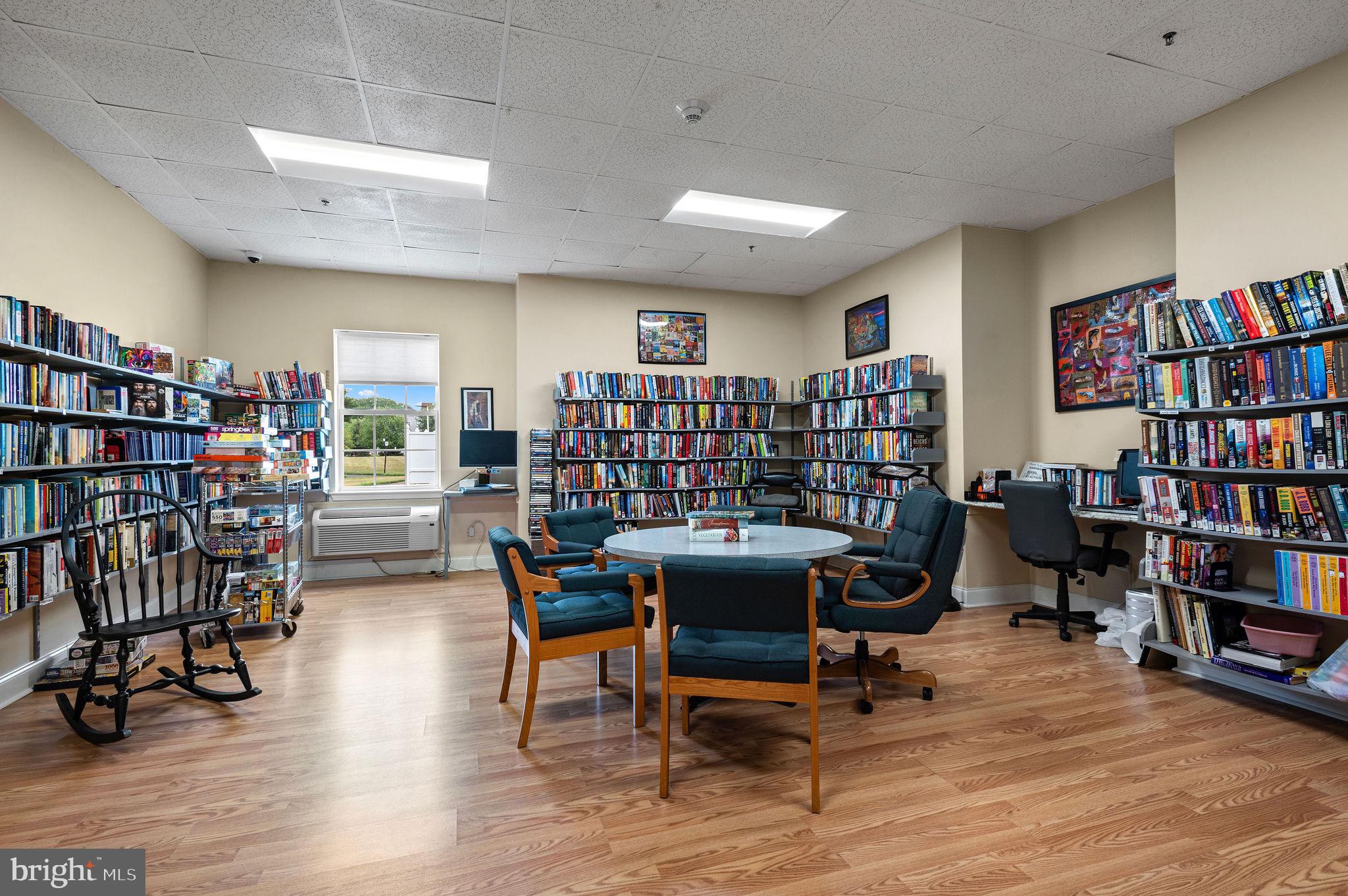 5303 Centennial Station Warminster, PA 18974 - Photo 41 of 60 a view of a workspace with furniture and a bookshelf