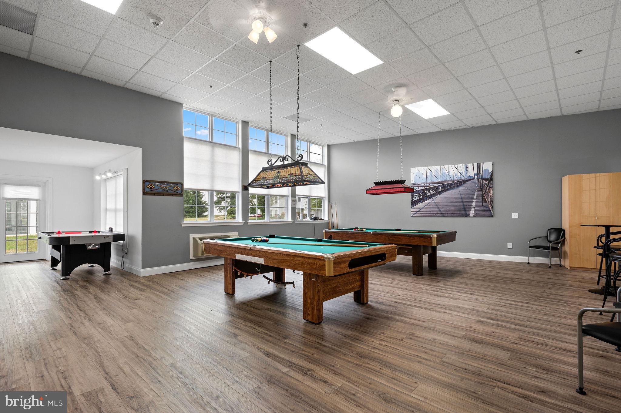5303 Centennial Station Warminster, PA 18974 - Photo 49 of 60 a room with wooden floor pool table and chairs