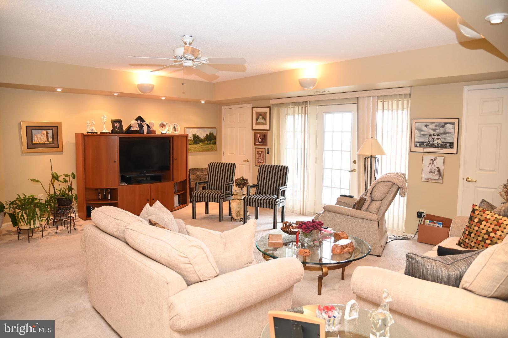 5303 Centennial Station Warminster, PA 18974 - Photo 5 of 60 a living room with furniture and a flat screen tv