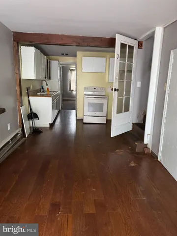 a view of a livingroom with furniture and a flat screen tv