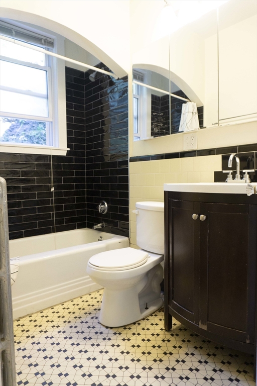 1789 Commonwealth Avenue, Unit 1 Boston, MA 02135 - Photo 11 of 11 a bathroom with a sink toilet and shower