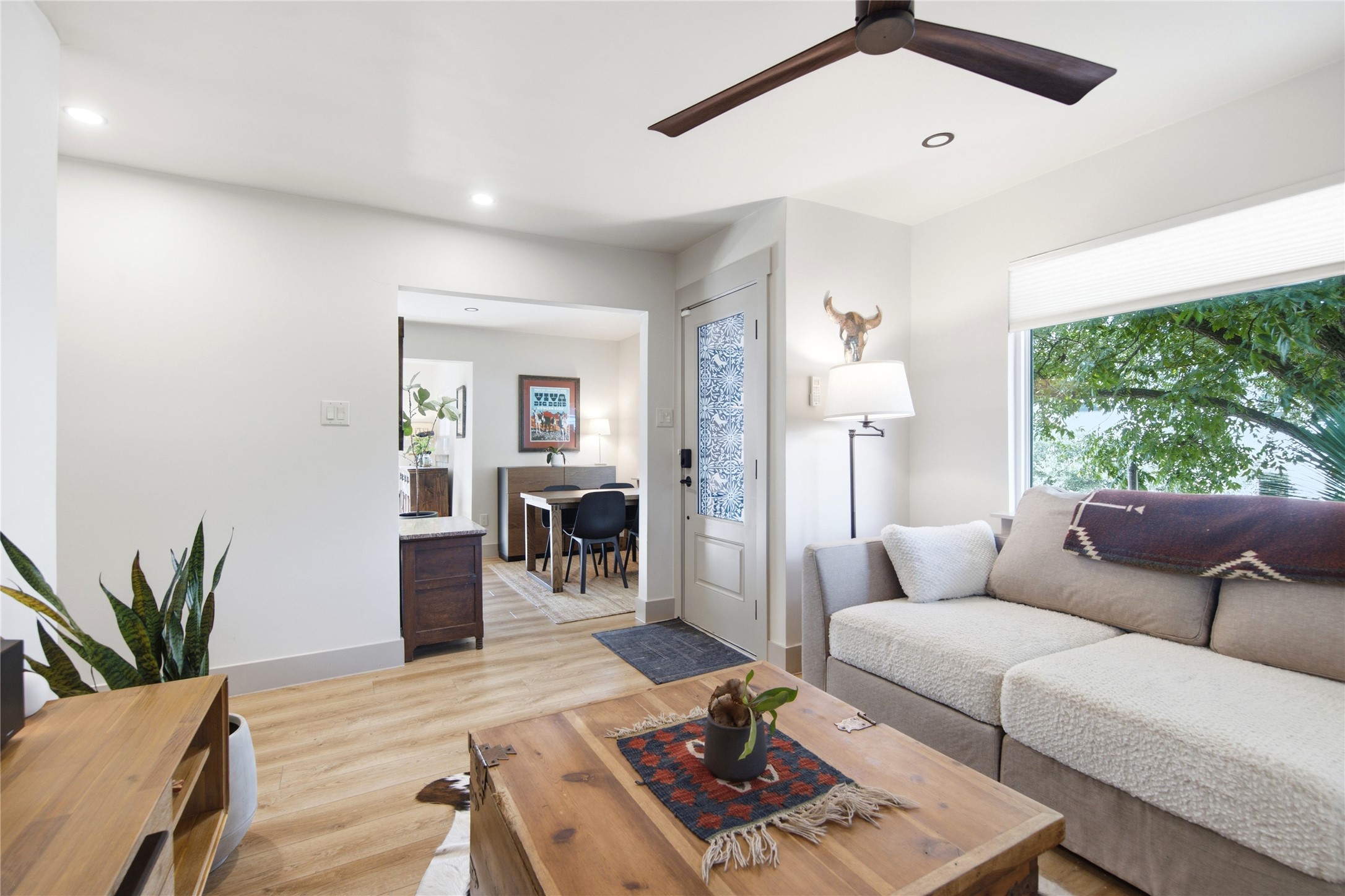 5600 Ledesma Road Austin, TX 78721 - Photo 10 of 36 Smooth wood flooring and a large picture window highlight this comfortable living area.