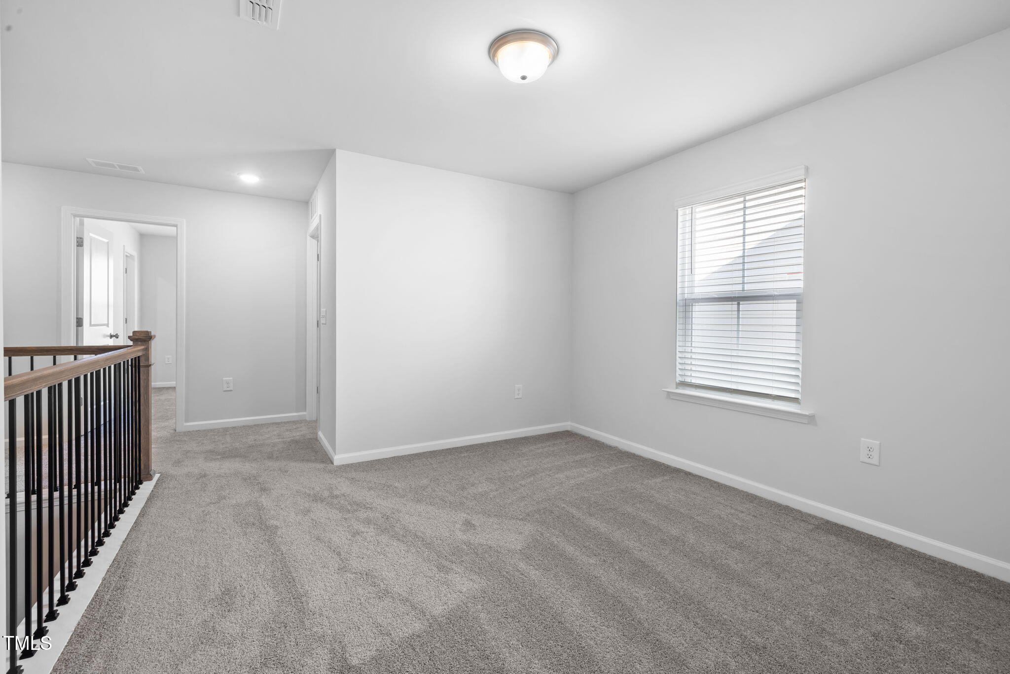 712 Ben Ledi Court Raleigh, NC 27603 - Photo 14 of 21 a view of an empty room with a window