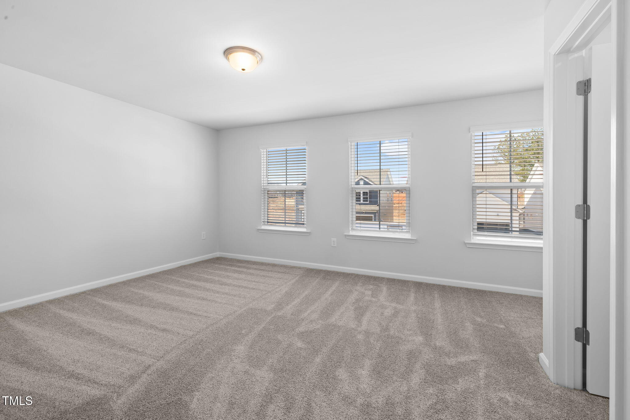 712 Ben Ledi Court Raleigh, NC 27603 - Photo 15 of 21 an empty room with windows