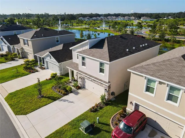 a aerial view of a house with a yard