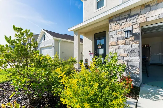 front view of a house with a small yard