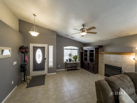 1411 Sims Street Ridgecrest, CA 93555 - Photo 4 of 35 a living room with furniture and a fireplace