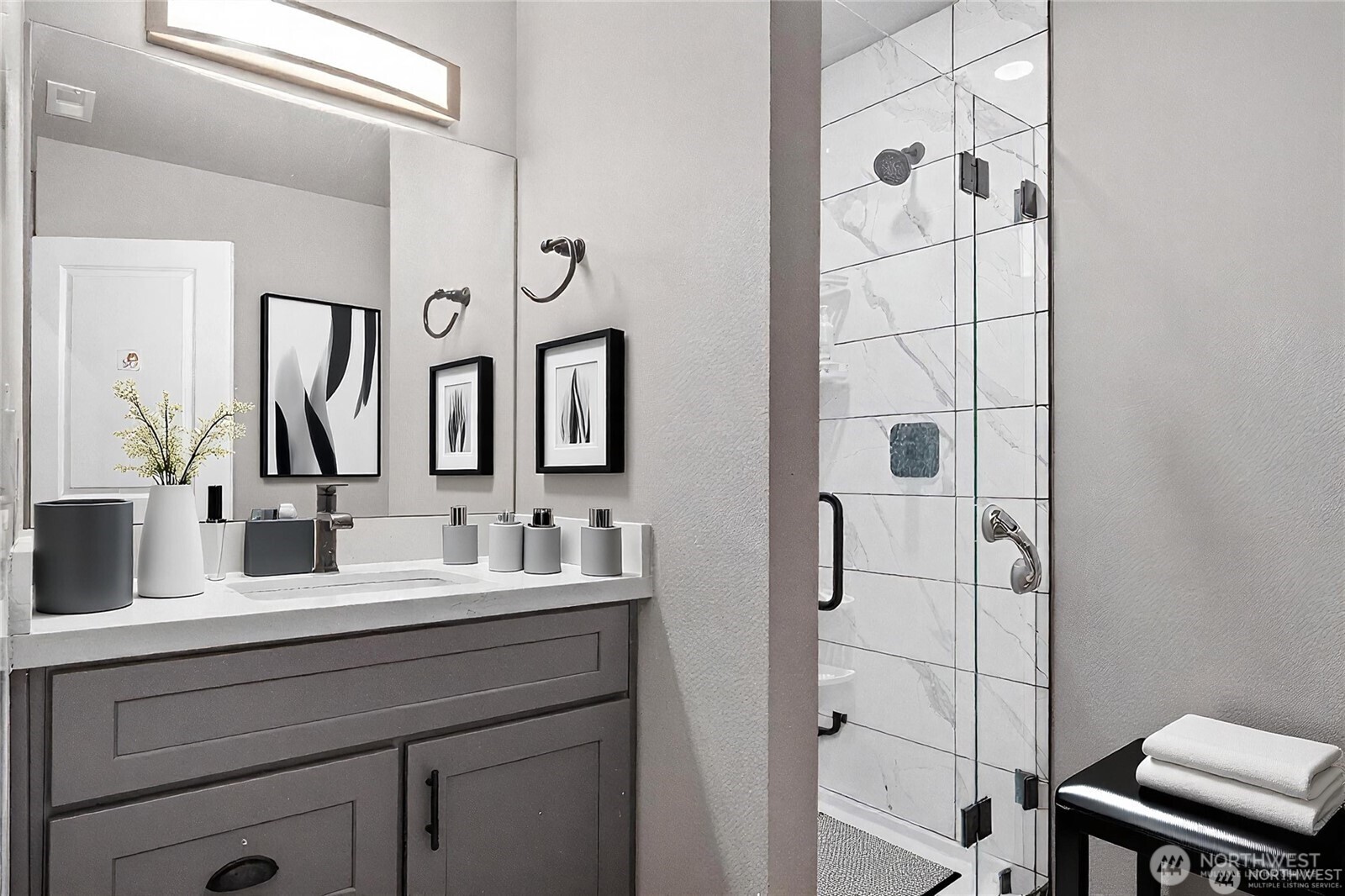 58 Ward Lane Manson, WA 98831 - Photo 27 of 37 a bathroom with a double vanity sink mirror and shower