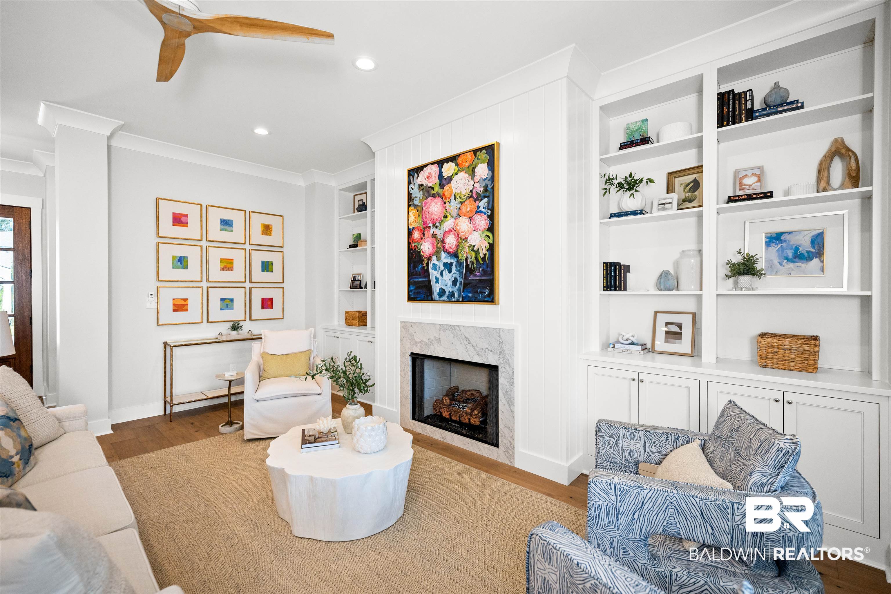 156 Hyacinth Street Fairhope, AL 36532 - Photo 8 of 61 Living room featuring a premium fireplace, wood finished floors, built in features, recessed lighting, and crown molding
