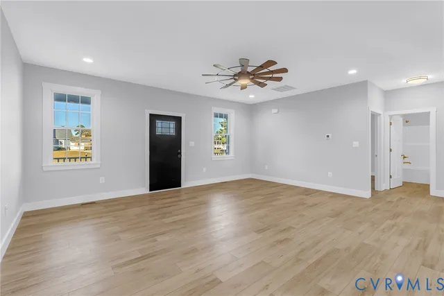 a view of an empty room with a window