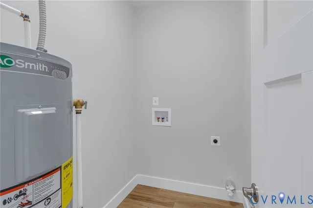 a view of hallway with wooden floor