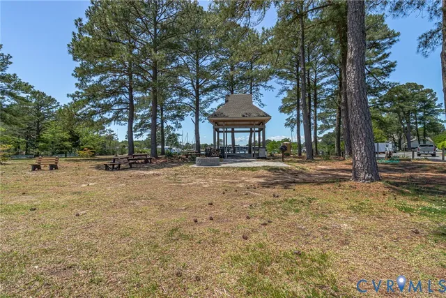 an aerial view of a houses with outdoor space and lake view