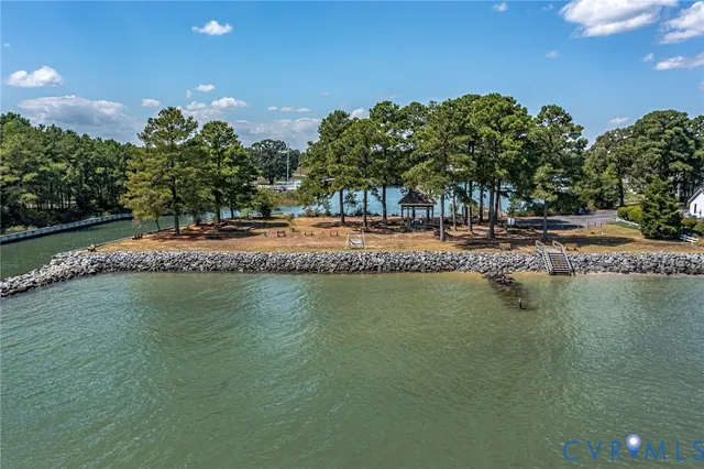 a swimming pool view with a lake view