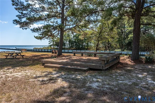 a view of swimming pool with lawn chairs yard