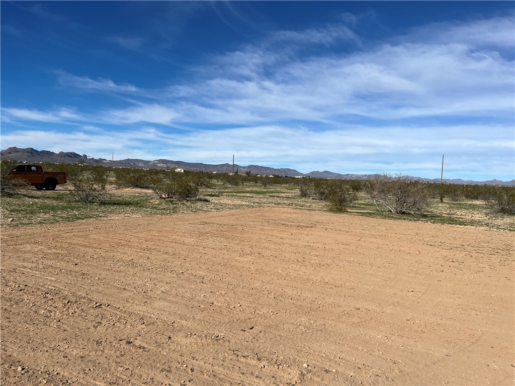 2034 South Cordes Road Golden Valley, AZ 86413 - Photo 9 of 17 Another view of cleared pad with Mountain Views in the Background