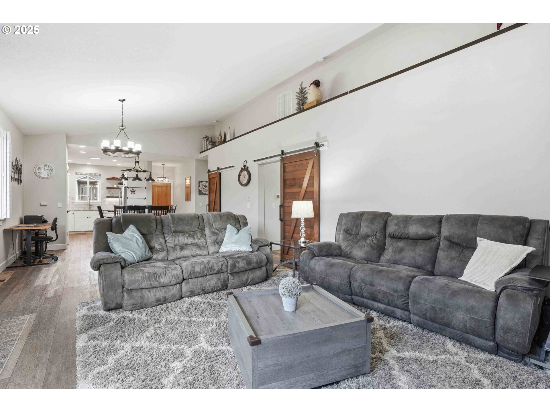112 Summit View Avenue Southeast Salem, OR 97306 - Photo 20 of 47 a living room with furniture and a chandelier