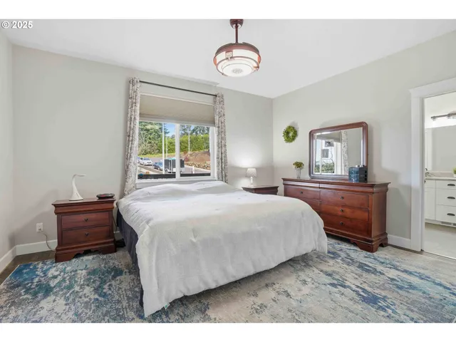 a bedroom with a bed and a dresser