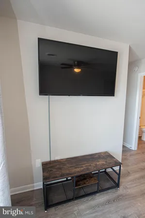 a bathroom with a sink toilet and mirror