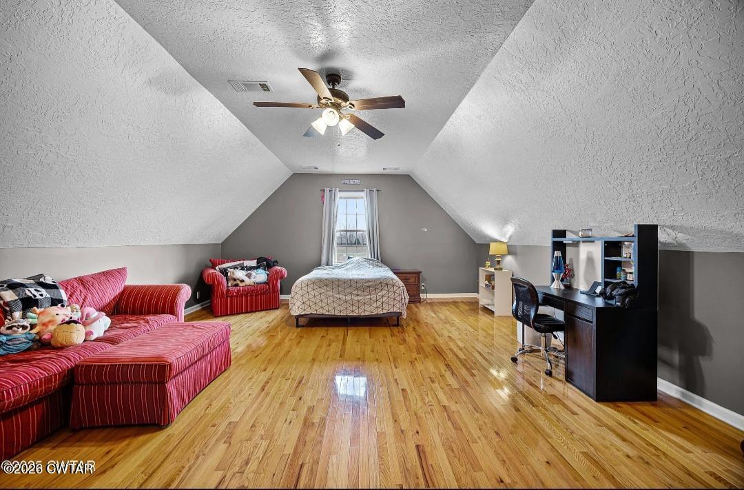 31 Turkey Creek Road Medina, TN 38355 - Photo 22 of 30 a bedroom with furniture and a wooden floor