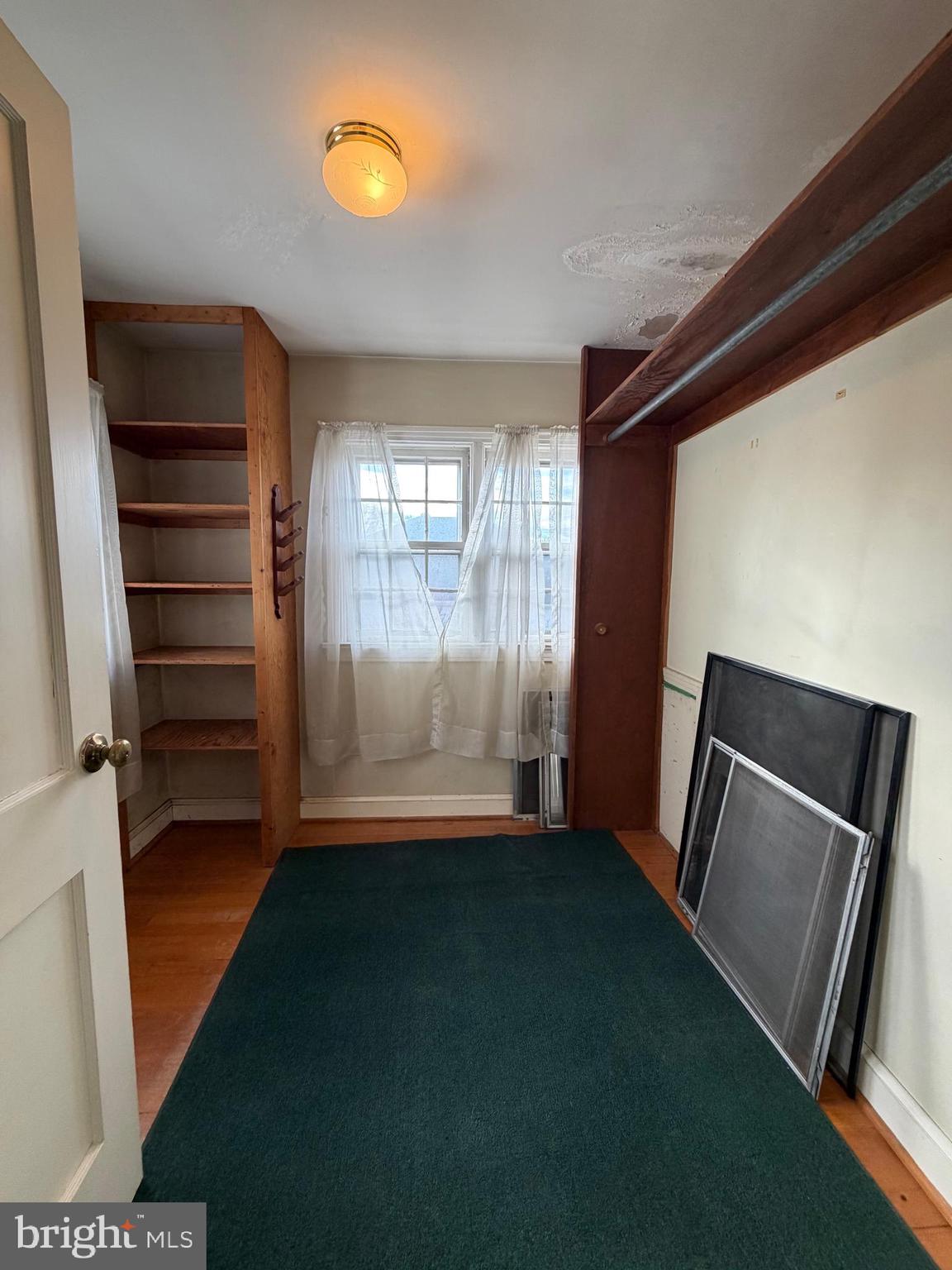 7203 Benedict Avenue Benedict, MD 20612 - Photo 13 of 23 a view of empty room with wooden floor and fan