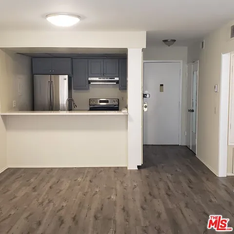 a view of kitchen with wooden floor