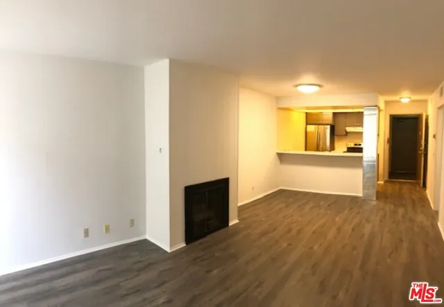 a view of a livingroom with wooden floor