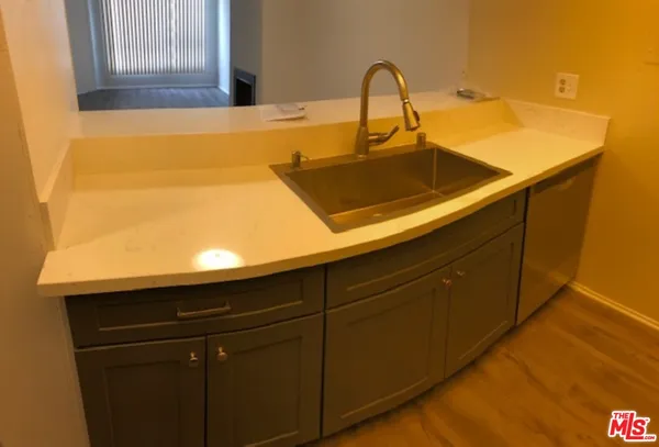 a close up of a sink and a mirror