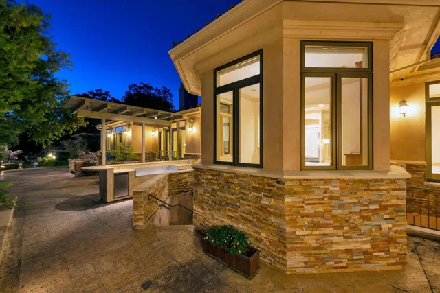 a view of swimming pool with outdoor seating and a patio