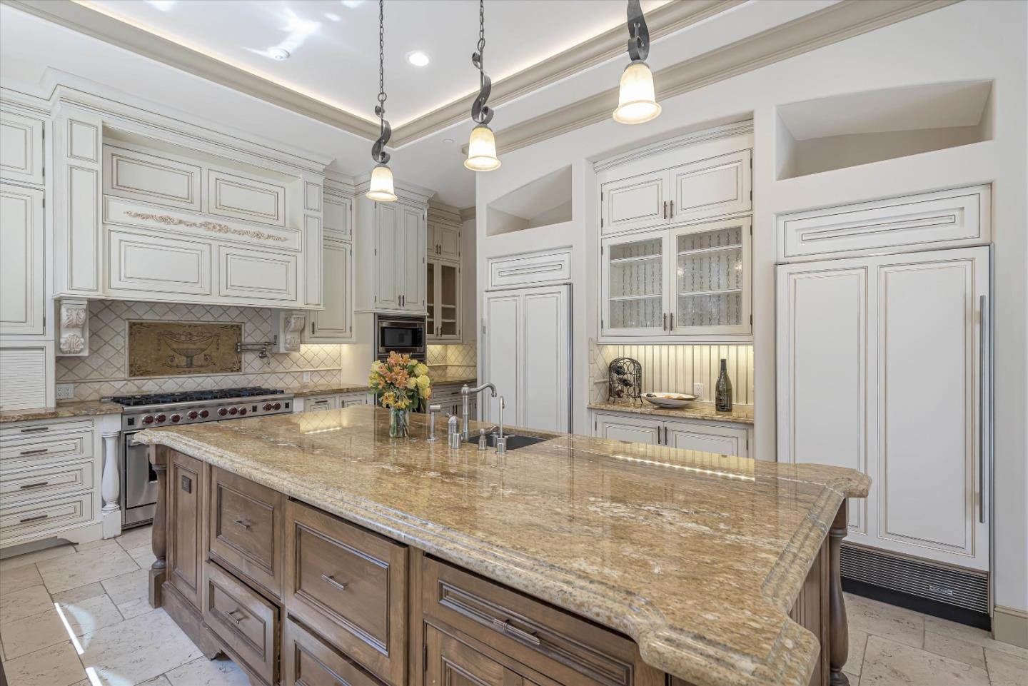 28025 Natoma Road Los Altos Hills, CA 94022 - Photo 22 of 44 a kitchen with stainless steel appliances granite countertop a sink a stove counter space and cabinets