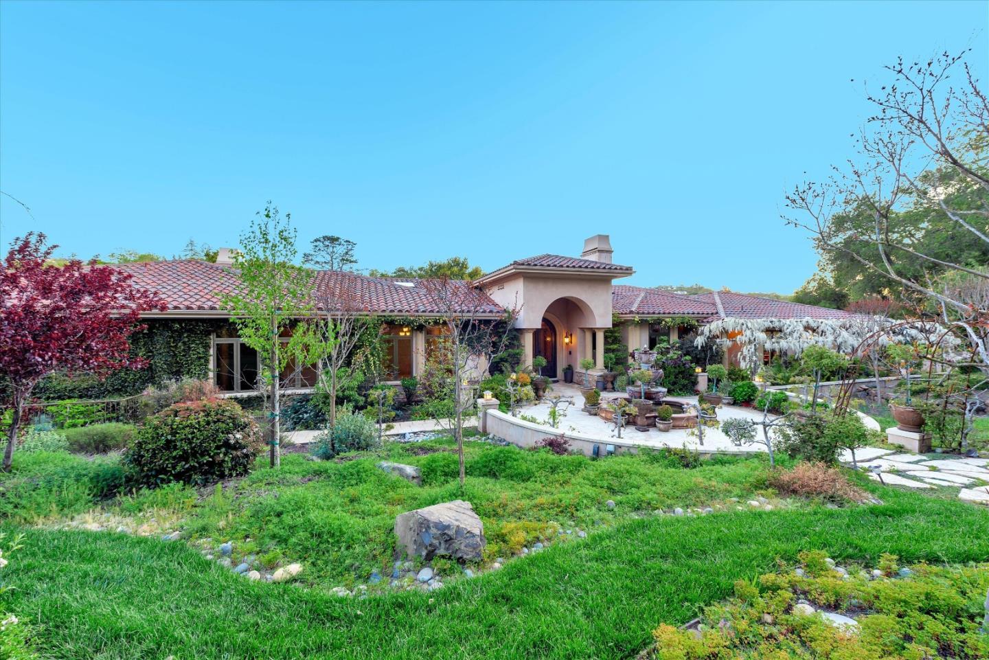 28025 Natoma Road Los Altos Hills, CA 94022 - Photo 38 of 44 a front view of a house with garden and outdoor seating