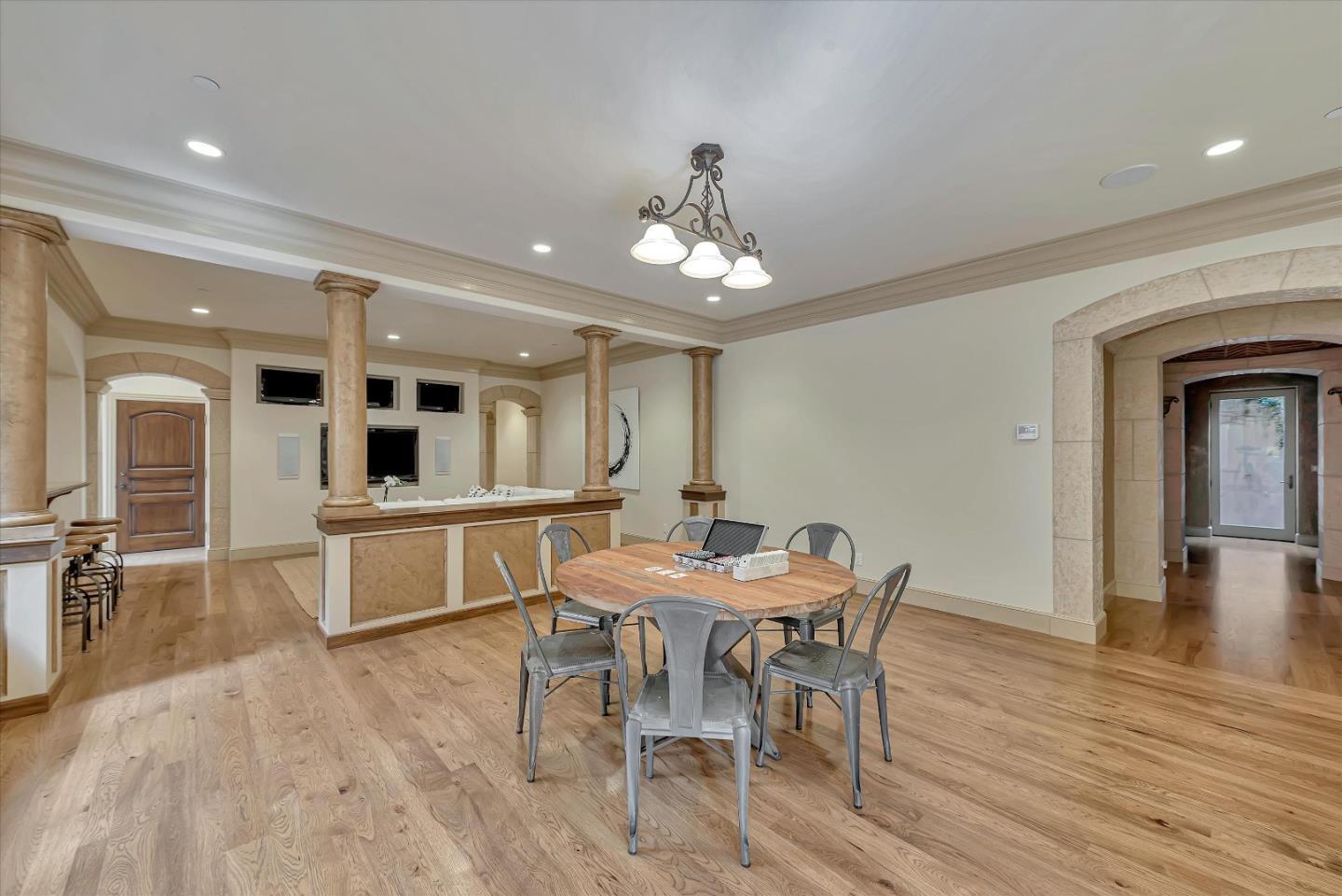 28025 Natoma Road Los Altos Hills, CA 94022 - Photo 44 of 44 a view of a dining room with furniture and wooden floor