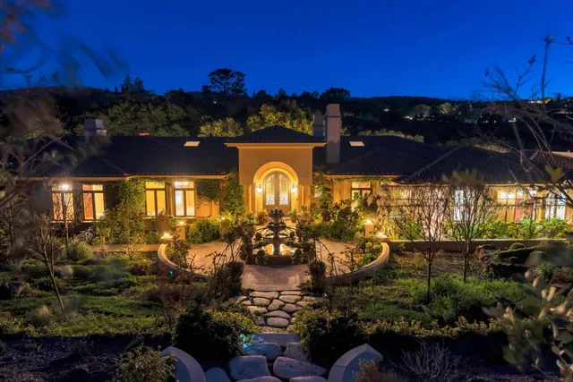 a view of living room with furniture and floor to ceiling window