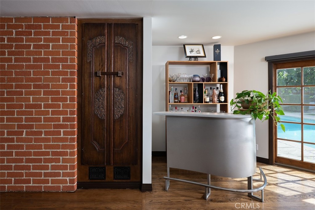 1222 Sharon Road Santa Ana, CA 92706 - Photo 13 of 34 a view of a workspace with furniture and a potted plant