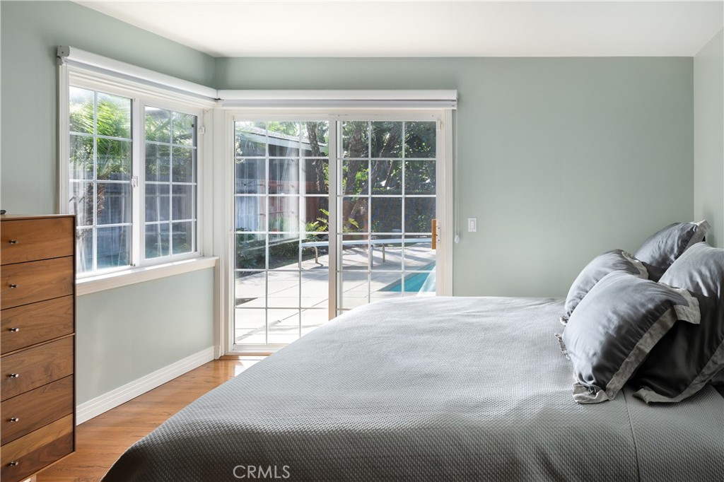 1222 Sharon Road Santa Ana, CA 92706 - Photo 15 of 34 a bed sitting in a bedroom next to a window