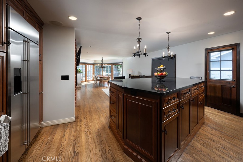 1222 Sharon Road Santa Ana, CA 92706 - Photo 8 of 34 a kitchen with stainless steel appliances granite countertop a sink a stove and a wooden floors